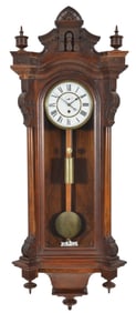 Seth Thomas Wall Regulator No. 5. The Eastlake carved walnut case has a 7.5 inch white enamel dial,