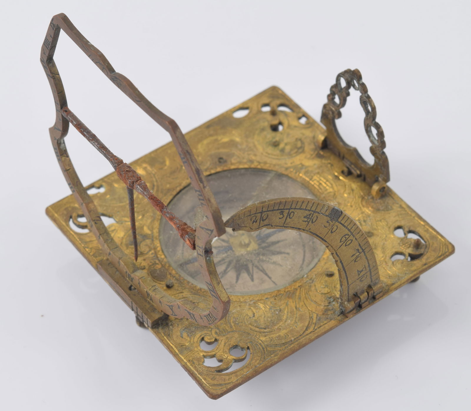 18th Century German brass pocket equinoctial compass sun dial, signed on reverse by Andreas Vogler,: 18th Century German brass pocket equinoctial compass sun dial, signed on reverse by Andreas Vogler, Augsburg. The engraved square form with silvered compass, shaped hour ring and spring loaded gnomon.