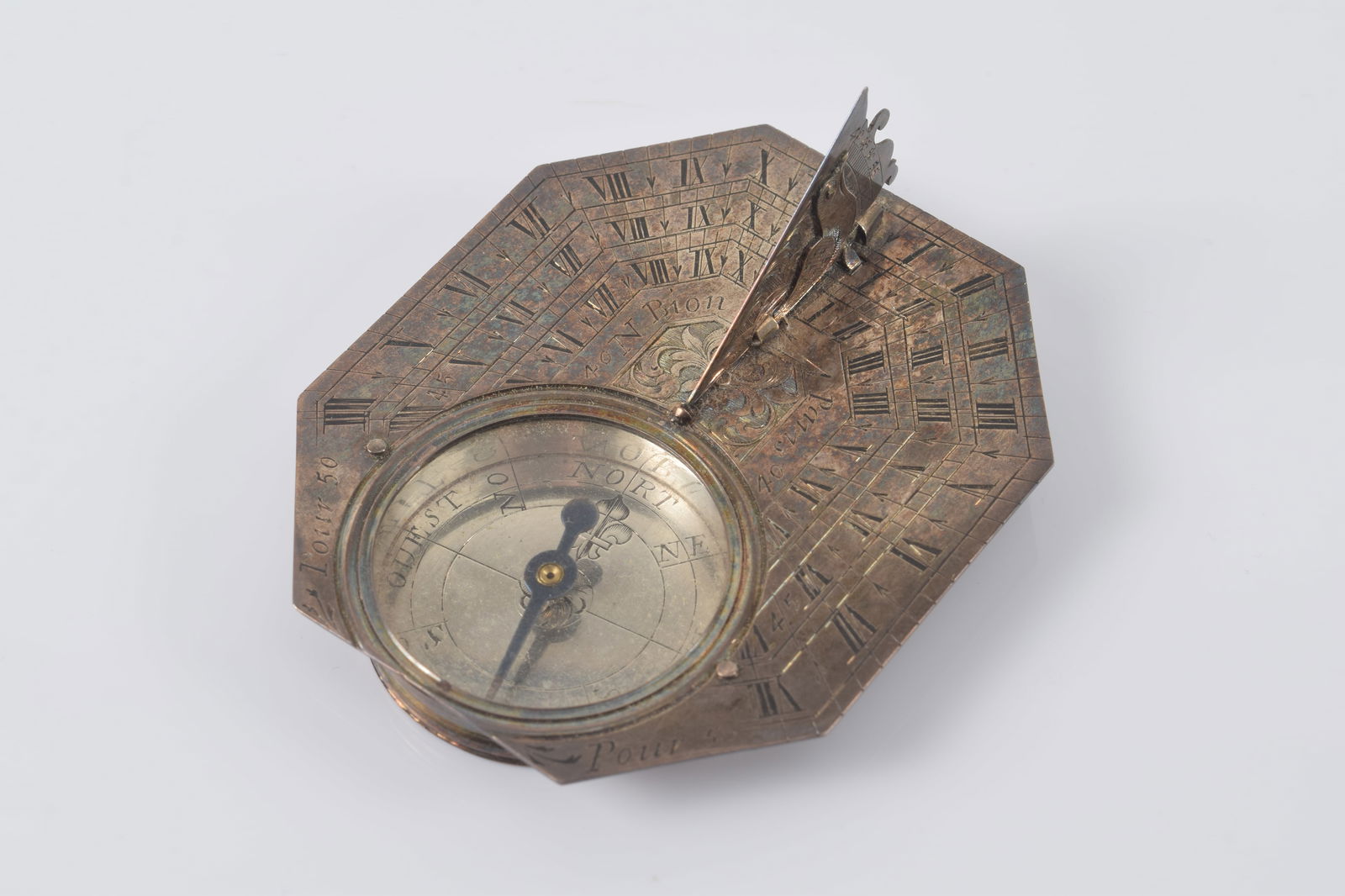 Early 19th Century silvered pocket sundial in an octagonal form with hinged bird form gnomon and (1 of 5)