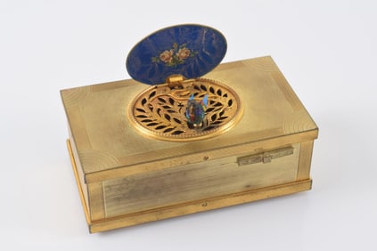 Antique gilt bronze automaton singing bird music box. Lid with enameled landscape and interior