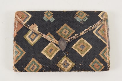 18th century American needlework wallet/purse. Black ground with geometric decoration. Silver clasp