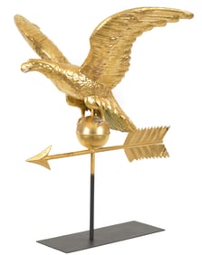 Antique gilt copper eagle weathervane. Eagle perched on ball and arrow. 24in high x 30.5in wide.