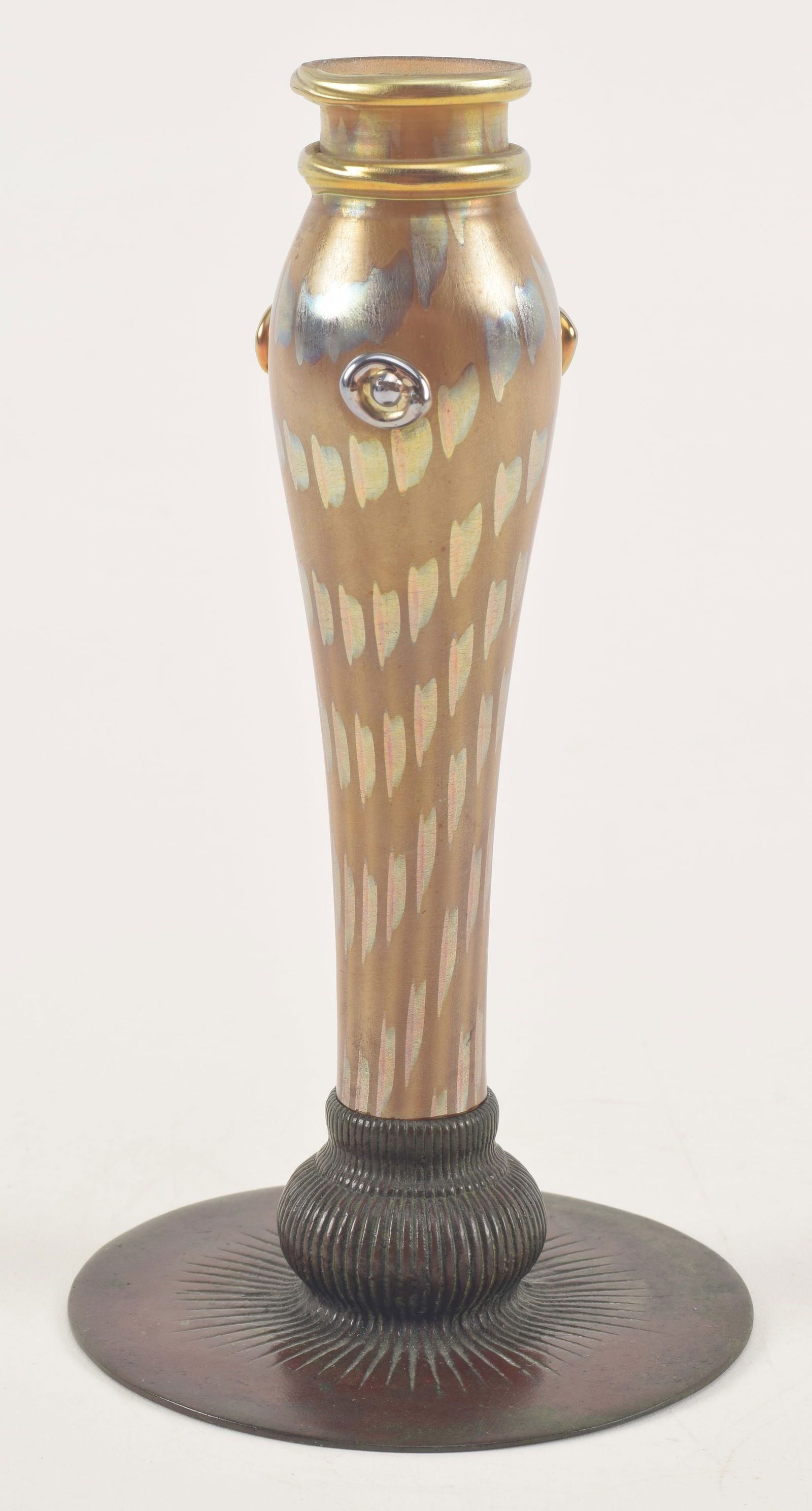 Tiffany Studios N.Y. bronze base cased favrile glass candlestick with applied rosette decoration.: Tiffany Studios N.Y. bronze base cased favrile glass candlestick with applied rosette decoration. Base signed and #710. Height assembled 7in.