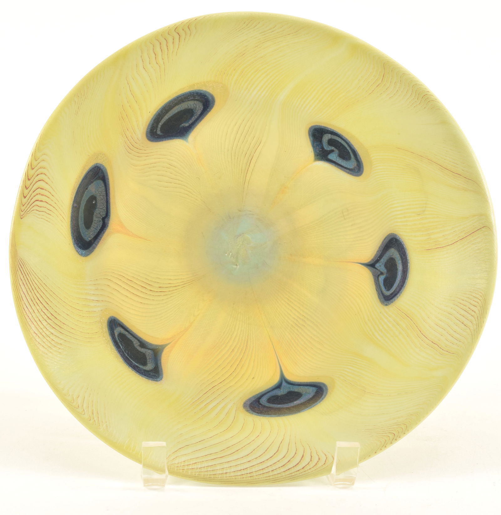 Tiffany Studios blown glass plate with favrile peacock feather motif, circa 1900. Etched L.C. (1 of 8)