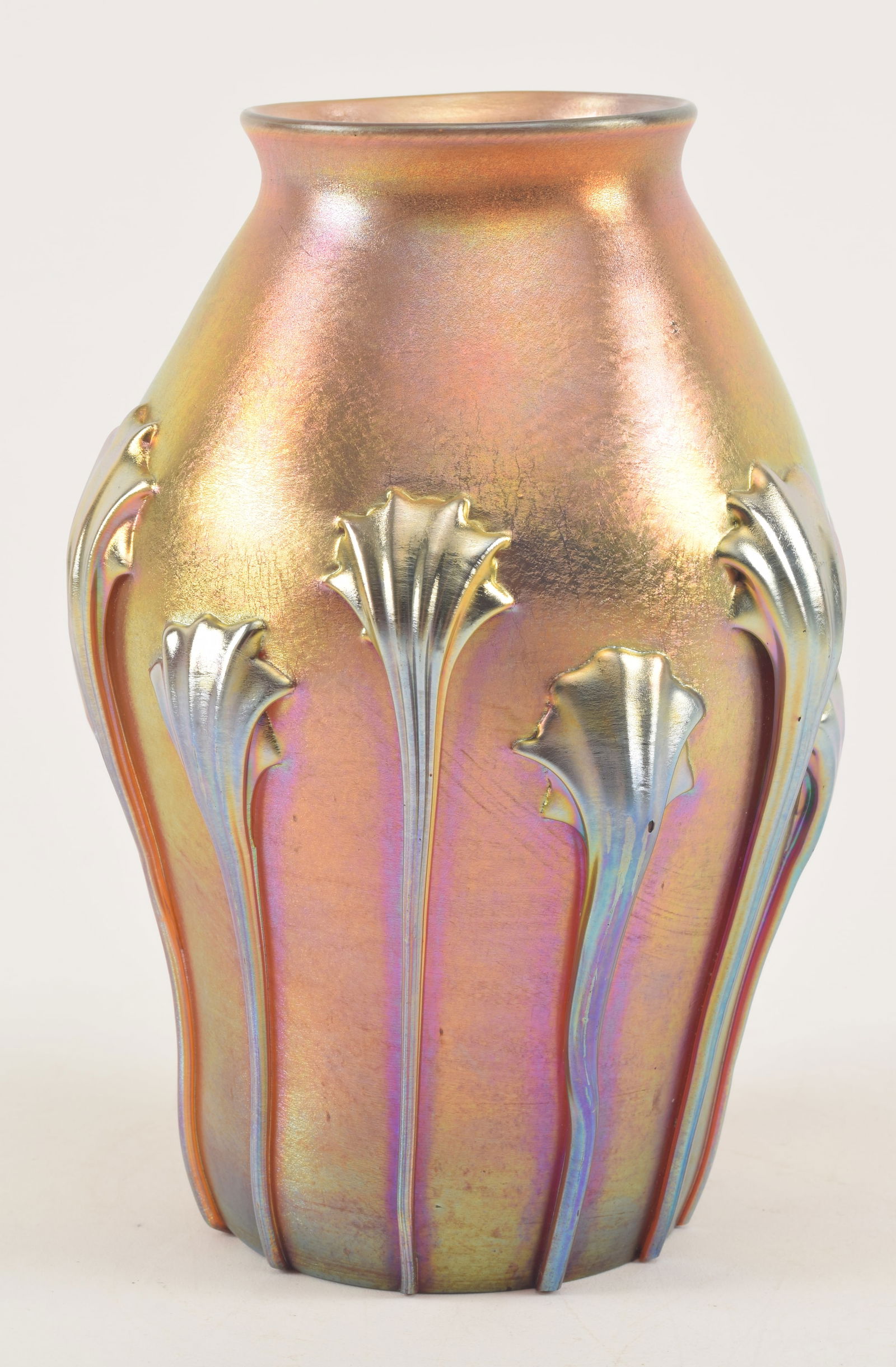 Tiffany favrile glass vase. Gold with hanging applied tendril decoration. Signed and numbered on: Tiffany favrile glass vase. Gold with hanging applied tendril decoration. Signed and numbered on base. 7.5in high.