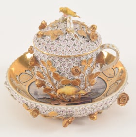 Meissen Snowball covered cup and saucer, under glazed blue mark. Each part with elaborate old master