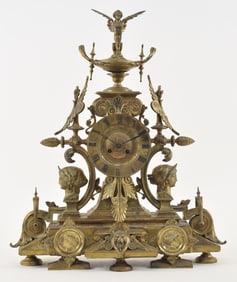 An elaborate gilt bronze French Eastlake shelf clock with elaborate stylize Classical mounts and
