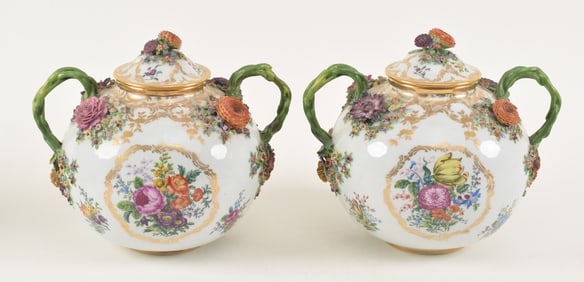 A fine pair of Meissen covered cache pot with vine form handles and applied floral decorations.