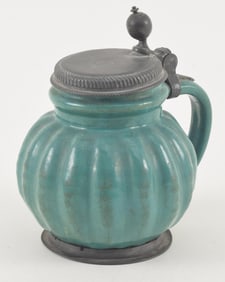 German blue green glazed earthenware tankard with lobed body and pewter cover and foot, Initials and