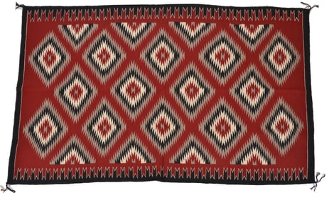 Navajo "eye dazzler" rug, second quarter of the 20th century. Red ground. Elouise John, the weaver.