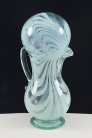 Blown pitcher and witches ball with loop decoration and green glass, 19th Century. Pitcher height