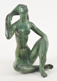Attributed to Carl Mose. Patinated bronze sculpture of a seated nude woman letting her hair down.