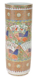 Porcelain umbrella stand. China. Ca. 1875. Export ware with decoration of fans on a rose canton gilt