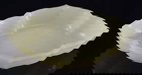 Jade dish. China. Chien Lung mark (1735-1796). Pure white, highly translucent stone. Foliate form: Jade dish. China. Chien Lung mark (1735-1796). Pure white, highly translucent stone. Foliate form with carved lotus petals. 4.75 x 3 x 1.5in.