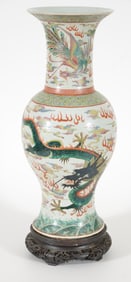 Porcelain vase. China. 19th century. Baluster form. Decoration of a red and green dragon with