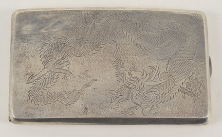 Silver card case. China. Early 20th century. Surface engraved with dragons. 5.25 x 3.25in.