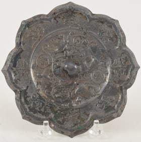 Bronze mirror. China. Tang dyansty (618-920). Foliated edge. Phoenix decoration. 5.5in diameter.