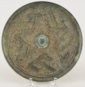 Bronze mirror. China. Han period (2nd century BC to 2nd century AD). T.L. type. 6.25in.