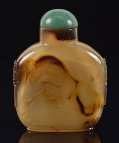 Shadow agate snuff bottle. China. Ca. 1900. Well hollowed. Surface carved to accentuate a landscape.