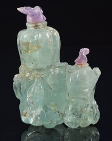 Beryl snuff bottle. China. Ca. 1900. Aquamarine stone carved as vegetables. Amethyst stoppers.