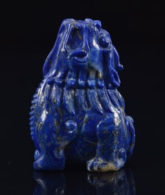 Lapis lazuli snuff bottle. China. Early 20th century. Carved as a foo dog in the round. 1.5in.