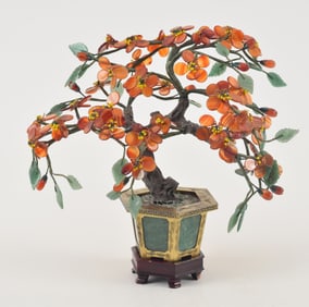 Ornamental tree. China. Early 20th century. Gilt metal and jade planter with a tree made of jade and