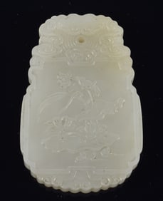 Oval jade pendant. China. 18th century. Surface carved with the Ho Ho Er Hsien. 2.25in.