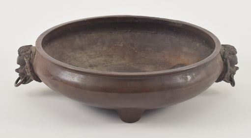 Bronze censer. China. 19th century. Pan shaped with "foreigner" mask jump rings. Extensive 16