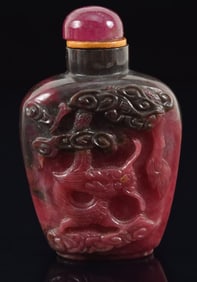Fine ruby in zoisite snuff bottle. China. Ca. 1970. Broad band of ruby with a small area of zoisite.