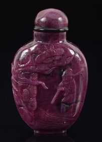Ruby snuff bottle. China. Early 20th century. Red cliff scene. Well hollowed. 2.25in.