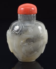 Jade snuff bottle. China. Ca. 1850. Highly translucent grey stone with darker clouds. Globular form.