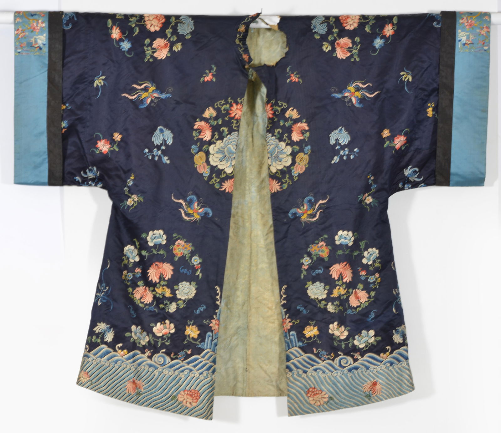 Woman's robe. China. 19th century. Dark blue ground with embroidered flowers and butterflies. (1 of 7)