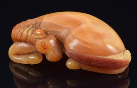 Very rare hornbill snuff bottle. China. Ca. 1850. Carved as a reclining horse, fully in the round.