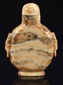 Mammoth fossil snuff bottle. China. Ca. 1900. Well hollowed. Matching stopper. 2.5in overall.