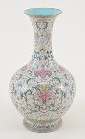 Porcelain vase. China. 18th century. Stylized bat and floral scrolling. Chien Lung mark. 14.5in.