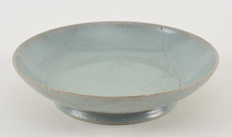Ru ware dish. China. Possibly Sung period. Carved chrysanthemum petals on the reverse. Extensive