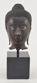 Bronze head of the buddha. Thailand. Sukhothai period (13th century). Inlaid eyes and traces of
