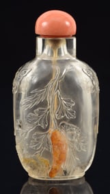 Rock crystal snuff bottle. China. Ca. 1800. Carved in relief with peonies and bamboo. Skin stylized