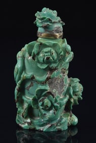 Turquoise snuff bottle. China. Early 20th century. Surface carved with flowers in high relief.
