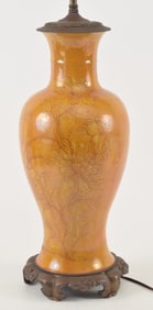 China 19th Century. Yellow glazed vase with incised decorations, mounted as a lamp. Vase height 17