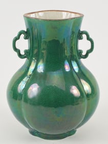 Porcelain vase. China. Early 20th century. Lobated form with Ju-i handles. Camelia leaf green