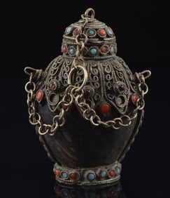 Mongol style snuff bottle. Early 20th century. Horn body with filigree set with coral red and