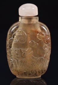 Smoky quartz snuff bottle. China. Ca. 1900. Surface carved with dragons. Well hollowed. 2.25in.