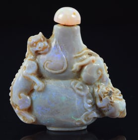 Opal snuff bottle. Double gourd shaped carved with chih lung. 1.5 x 1.5in.