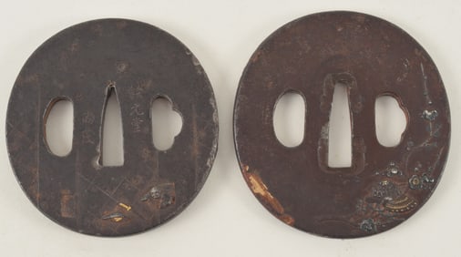 2 sword guards. Japan. 19th century. Iron tsuba with gold and silver inlay.