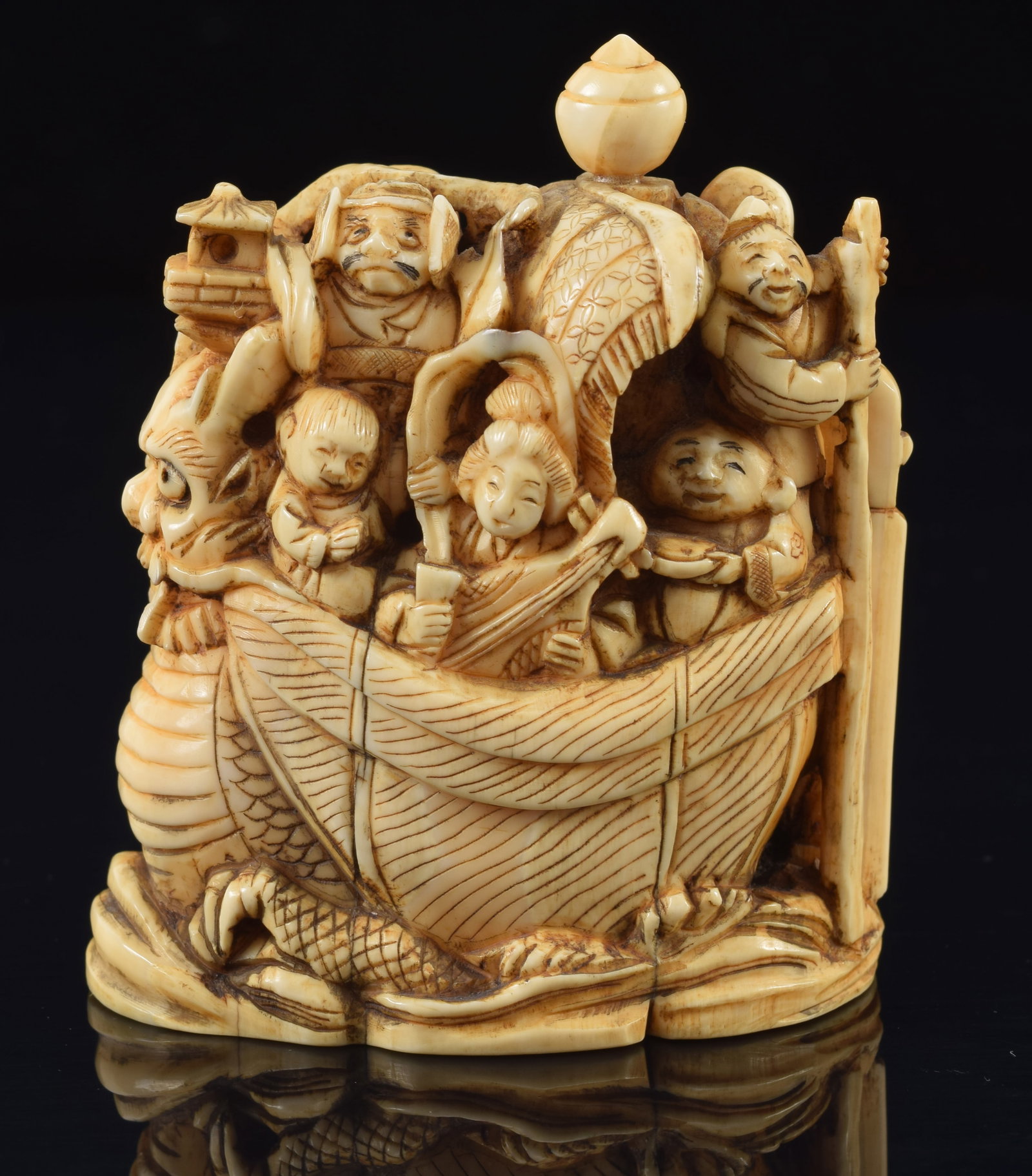 Okimono of the ship of wealth. Japan. 19th century. Signed Gyokotomo. 2.5 x 2.75in.: Okimono of the ship of wealth. Japan. 19th century. Signed Gyokotomo. 2.5 x 2.75in.Buyer's notice: This item can only be purchased and picked up from our gallery in Massachusetts. We will not facilita