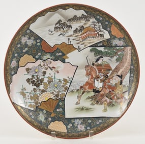 Porcelain charger. Japan. Early 20th century. Kutani ware. Signed. Scene of decorated fans on a