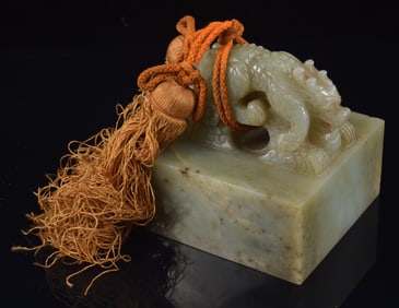 Jade seal. China. 19th century. Grey stone with a double dragon finial. Inscription intact. 3.25x