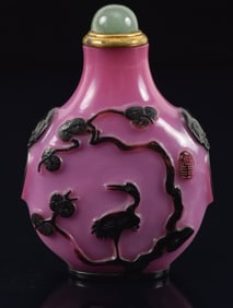 Peking glass snuff bottle. China. Ca. 1850. Cameo glass cut black to mauve with chicks, millet, a