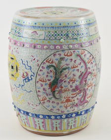 Porcelain garden seat. China. 19th/early 20th century. Barrel form with famille rose decoration of